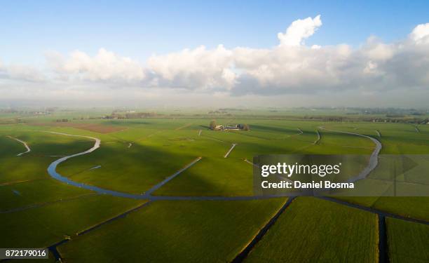 remnants of a bending river in cultivated dutch landscape, seen from the air - groningen province stock pictures, royalty-free photos & images