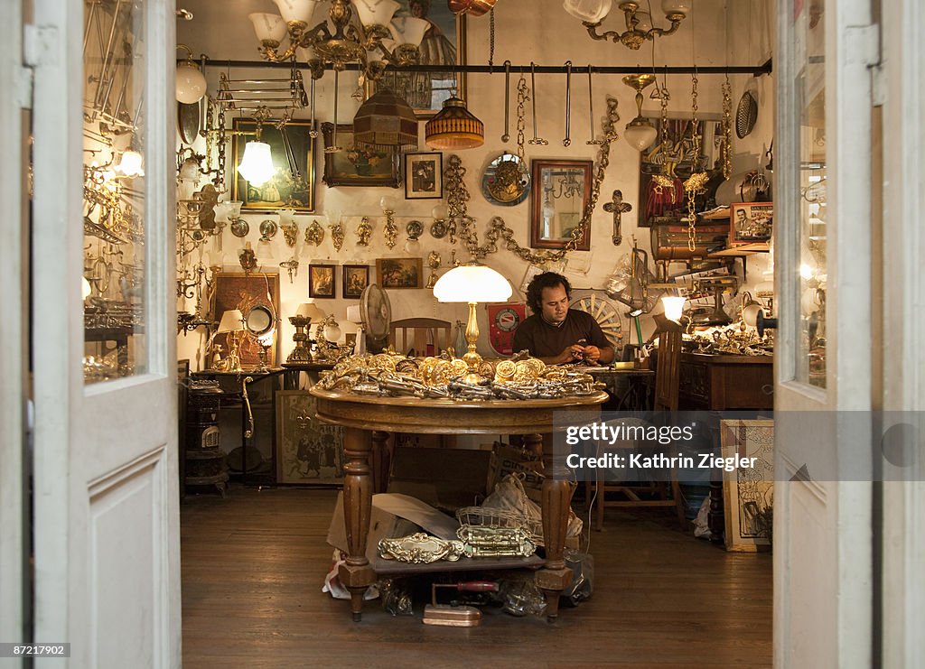 Man working in antique shop