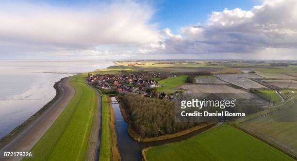 aerial photo of a historical village called wierum and its hinterland - dyke stockfoto's en -beelden