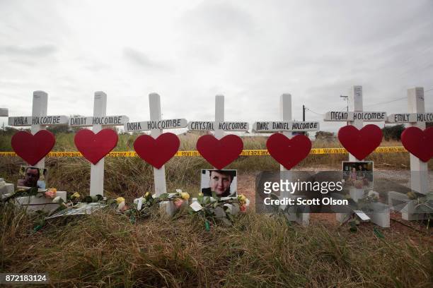 Twenty-six crosses sit just outside crime scene tape along Highway 87 near the First Baptist Church of Sutherland Springs to honor the 26 victims...