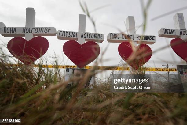 Twenty-six crosses sit just outside crime scene tape along Highway 87 near the First Baptist Church of Sutherland Springs to honor the 26 victims...