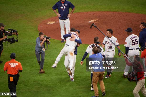 World Series: Rear view of Houston Astros Alex Bregman victorious hugging manager A.J. Hinch after winning game vs Los Angeles Dodgers at Minute Maid...