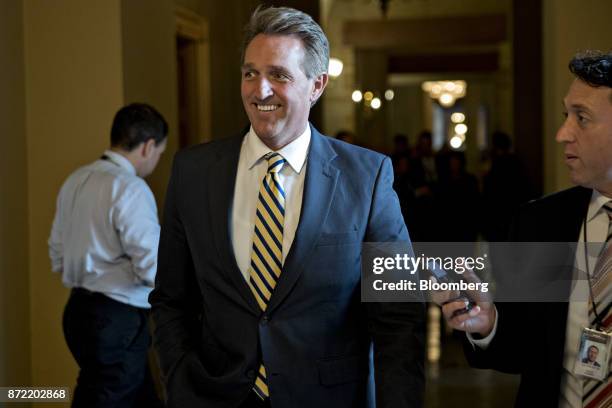 Senator Jeff Flake, a Republican from Arizona, walks through the U.S. Capitol after a closed-door GOP conference meeting to discus tax reform at the...