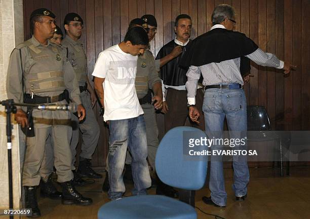 Brazilian Mohamed D'Ali Carvalho dos Santos arrives in court under custody for his trial in Goiania, central Brazil May 14, 2009. Dos Santos is...