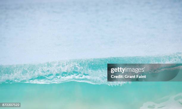 single wave crashing on empty beach. - bondi beach sign stock pictures, royalty-free photos & images