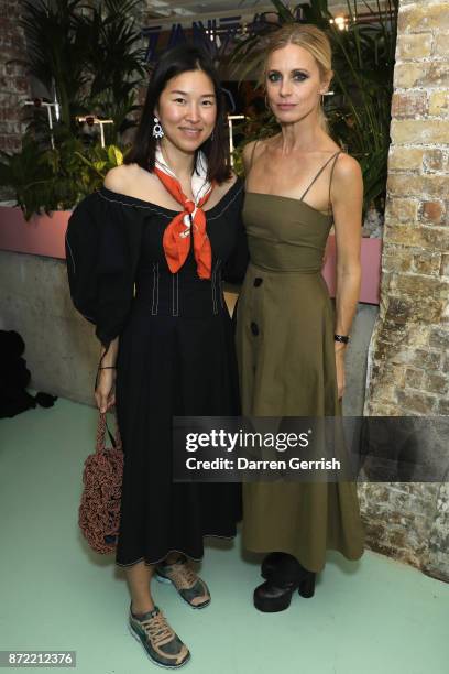 Rejina Pyo and Laura Bailey attend a cocktail party hosted by Laura Bailey and Zanzan at Alex Eagle on November 9, 2017 in London, England.