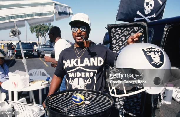 An NFL fan celebrates the return of the Raiders in this 1995 Oakland, California, photo taken in the stadium parking lot.