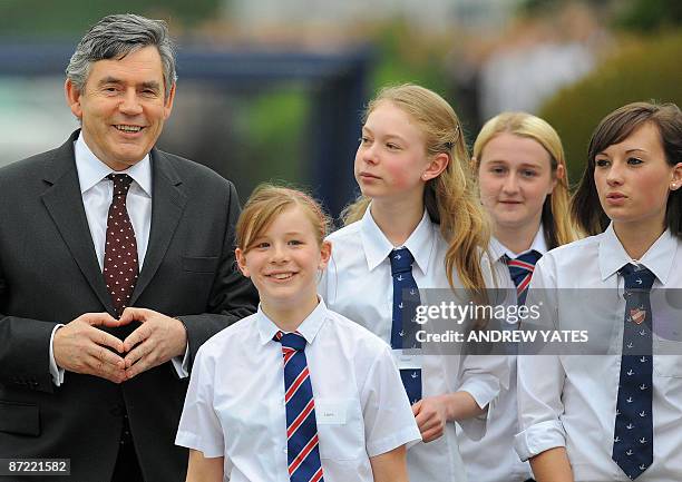 Britain's Prime Minister Gordon Brown arrives at Kirk Hallam community college in Ikeston, in Derbyshire, on May 14 as he attends the Labour Party...