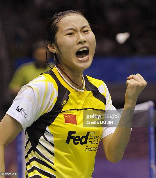 China's Wang Yihan celebrates after winning over Indonesia's SMaria Kristin Yulianti during the women's singles preliminary match at the Sudirman Cup...