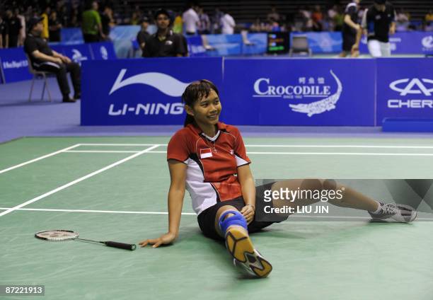 Indonesia's SMaria Kristin Yulianti reacts to a losing point against China's Wang Yihan during the women's singles preliminary match at the Sudirman...