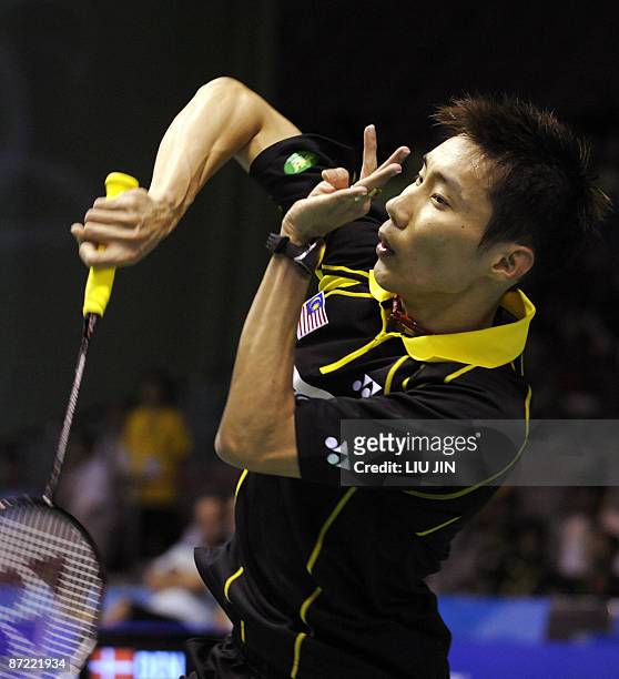 Malaysia's Lee Chong Wei returns a shuttlecock against Denmark's Jan O Jorgensen during the men's singles preliminary match at the Sudirman Cup World...
