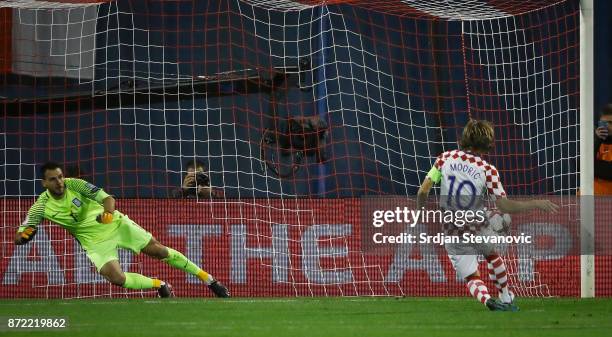 Luka Modric of Croatia scores the goal from penalty kick near goalkeeper Orestis Karnezis of Greece during the FIFA 2018 World Cup Qualifier...