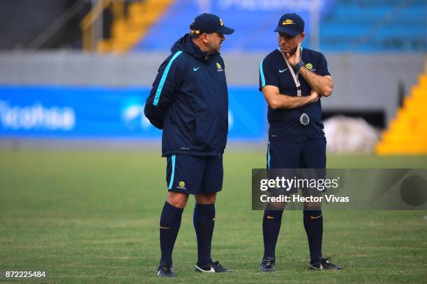 Ange Postecoglou coach of Australia talks with Ante Milicic assistant manager of Australia during a training session ahead of the leg 1 of FIFA World...