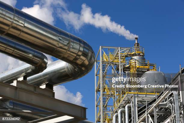 steam rises from a new ammonia production unit currently under testing - fertilizer stock pictures, royalty-free photos & images