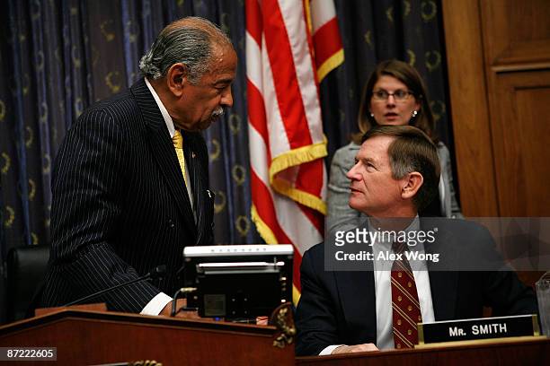 Committee Chairman Rep. John Conyers talks to ranking member Rep. Lamar Smith prior to a hearing before the House Judiciary Committee on Capitol Hill...