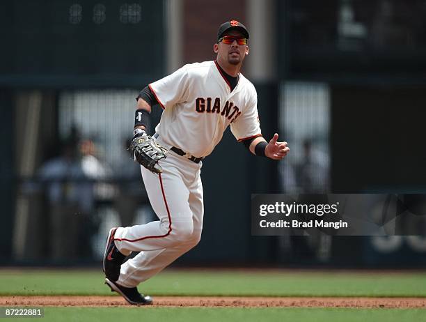 Travis Ishikawa of the San Francisco Giants plays defense at first base against the Washington Nationals during the game at AT&T Park on May 13, 2009...