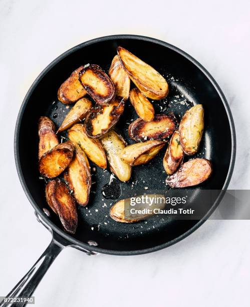 roasted potatoes - fingerling potato stock pictures, royalty-free photos & images