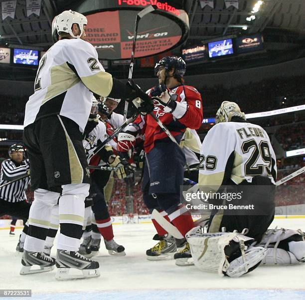 Alex Ovechkin of the Washington Capitals is moved from the crease by Hal Gill of the Pittsburgh Penguins during Game Seven of the Eastern Conference...