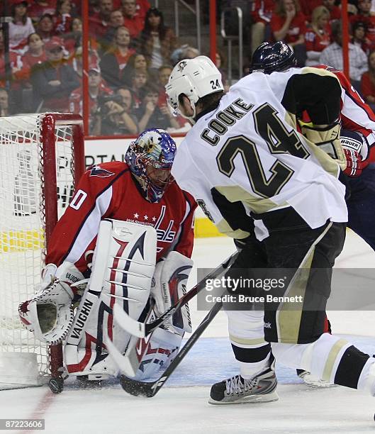 Simeon Varlamov of the Washington Capitals makes the save on Matt Cooke of the Pittsburgh Penguins during Game Seven of the Eastern Conference...