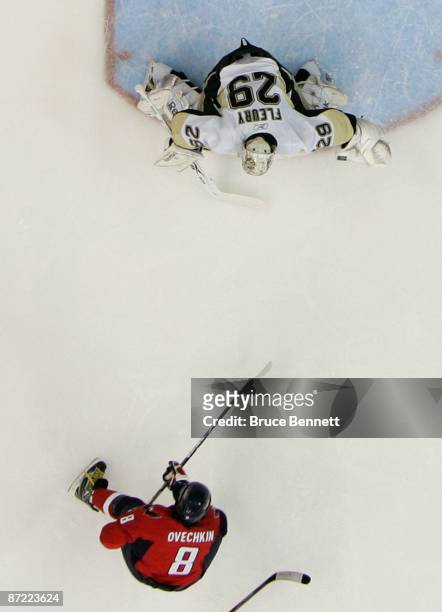Alex Ovechkin of the Washington Capitals skates in on Marc-Andre Fleury of the Pittsburgh Penguins during first period action in Game Seven of the...