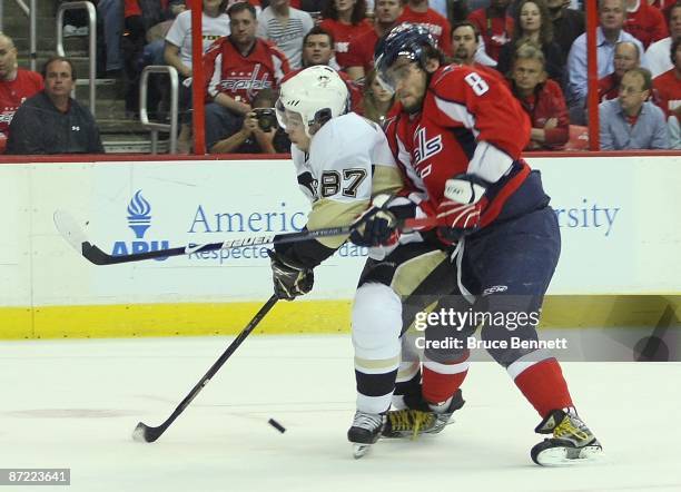 Alex Ovechkin of the Washington Capitals skates against Sidney Crosby of the Pittsburgh Penguins during Game Seven of the Eastern Conference...