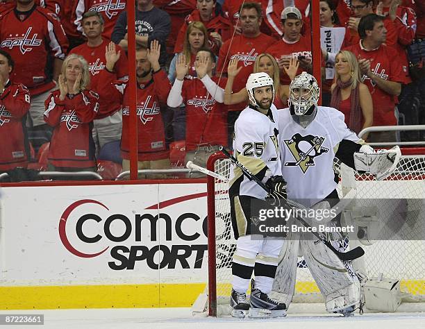 Maxime Talbot and Marc-Andre Fleury of the Pittsburgh Penguins celebrate their 6-2 win over the Washington Capitals in Game Seven of the Eastern...