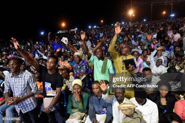 People attend the speech of German pentecostal evangelist Reinhard Bonnke during his "farewell gospel crusade", on November 9, 2017 in Lagos. / AFP...