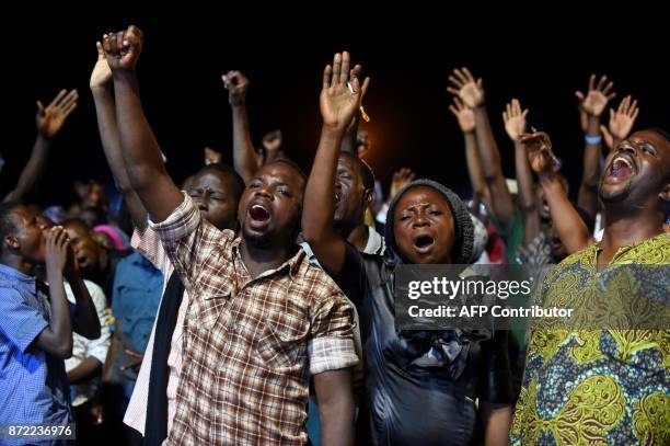 People attend the speech of German pentecostal evangelist Reinhard Bonnke during his "farewell gospel crusade", on November 9, 2017 in Lagos. / AFP...