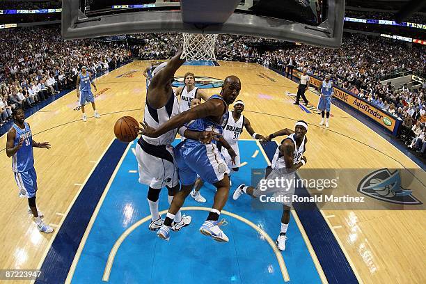 Guard Chauncey Billups of the Denver Nuggets takes a shot against Erick Dampier of the Dallas Mavericks in Game Four of the Western Conference...