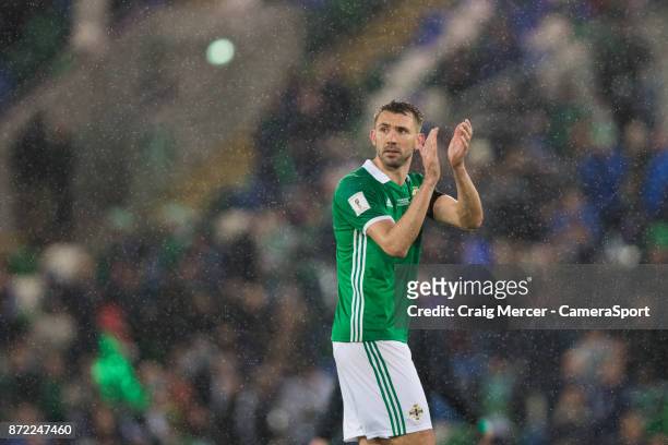 Northern Irelands Gareth McAuley applauds the fans at the final whistle during the FIFA 2018 World Cup Qualifier Play-Off: First Leg between Northern...