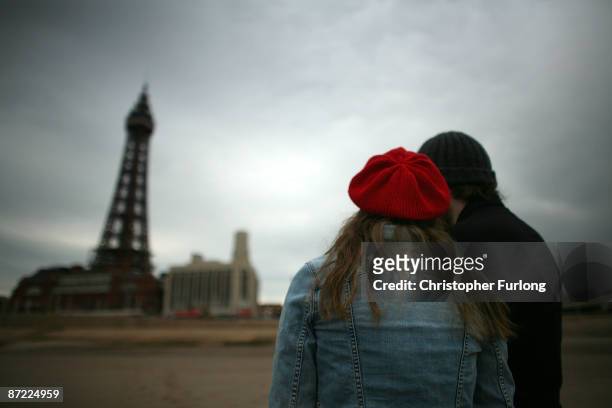 Young couple stroll on Blackpool's beach on May 14, 2009 in Blackpool, England. Blackpool tourist board have launched a new advertising campaign...