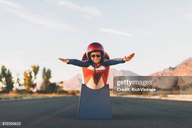 young stunt boy and human cannon ball - human cannon ball stock pictures, royalty-free photos & images