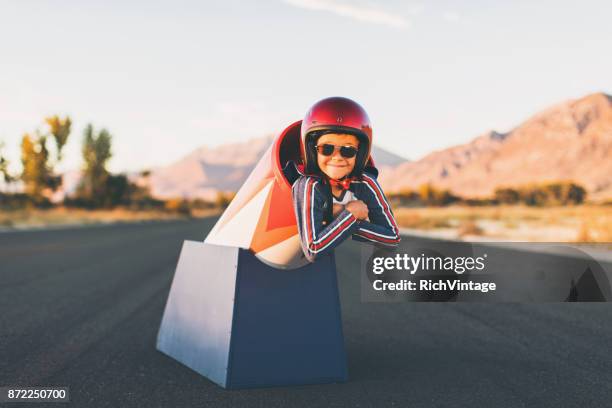 young stunt boy and human cannon ball - human cannon ball stock pictures, royalty-free photos & images