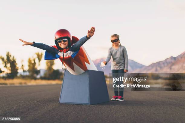 young stunt boy and human cannon ball - daredevils and stunts imagens e fotografias de stock