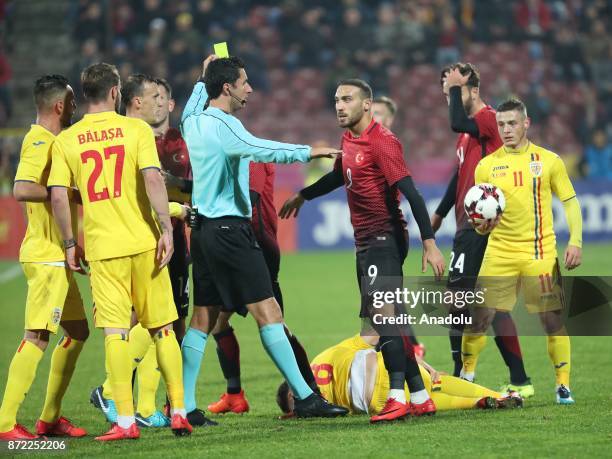 Cenk Tosun of Turkey argues with his opponent during the friendly match between Romania and Turkey at Dr. Constantin Radulescu Stadium in...