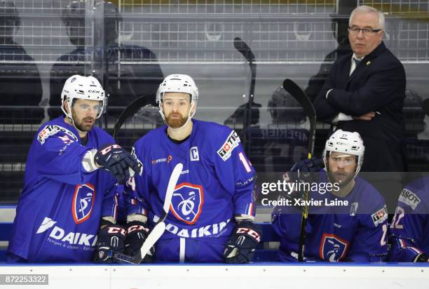 Captain Stephane Da Costa of France react with Damien Fleury during the EIHF Ice Hockey Four Nations tournament match between France and Slovenia at...