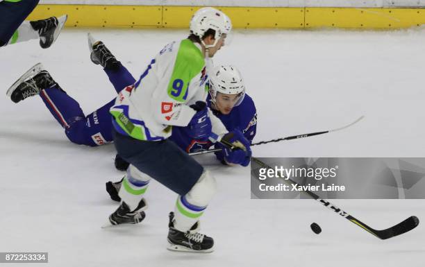 Miha Verlic of Slovenia in action with Hugo Gallet of France during the EIHF Ice Hockey Four Nations tournament match between France and Slovenia at...