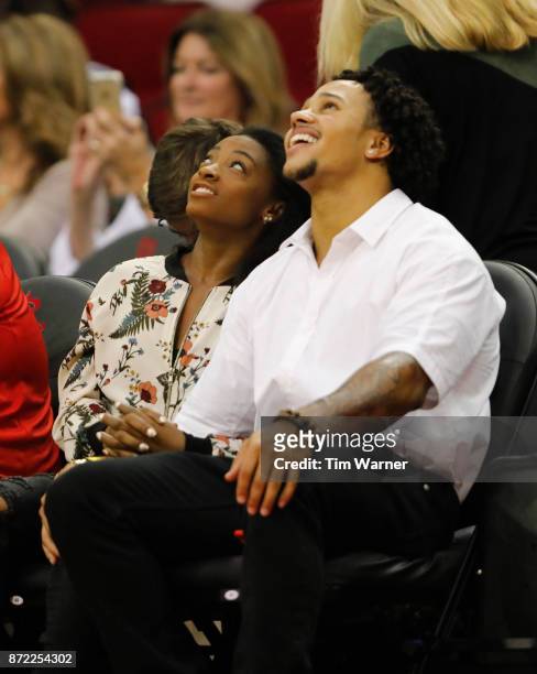 Simone Biles and Stacey Ervin watch the game between the Houston Rockets and the Utah Jazz at Toyota Center on November 5, 2017 in Houston, Texas....