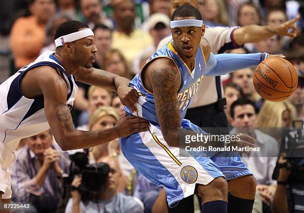 Forward Carmelo Anthony of the Denver Nuggets dribbles the ball against Antoine Wright of the Dallas Mavericks in Game Four of the Western Conference...