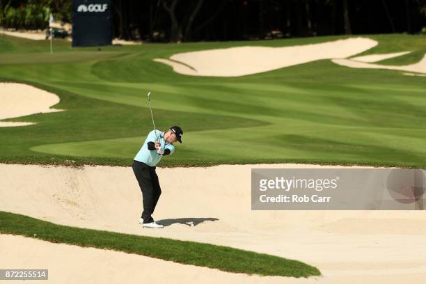 Martin Piller of the United States plays a shot from a bunker on the 18th hole during the first round of the OHL Classic at Mayakoba on November 9,...