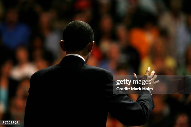 President Barack Obama addresses a crowd at the Rio Rancho High School gymnasium during a Town Hall meeting on May 14, 2009 in Rio Rancho, New...