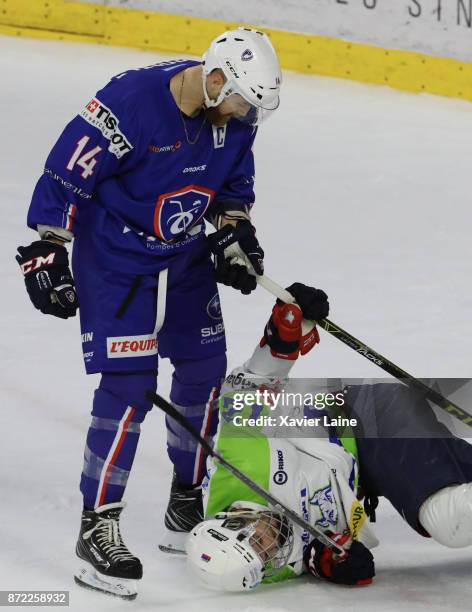 Captain Stephane Da Costa of France fight with David Rodman of Slovenia during the EIHF Ice Hockey Four Nations tournament match between France and...