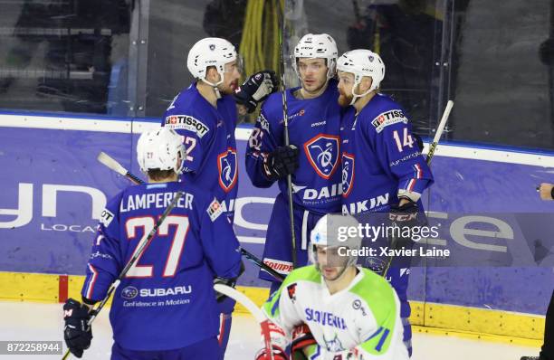 Charles Bertrand of France celebrate his goal with Stephane Da Costa and Florian Chakiachvilli during the EIHF Ice Hockey Four Nations tournament...