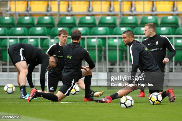 To R, Tommy Smith, Michael McGlinchey, Andrew Durante, Winston Reid and Chris Wood stretch during a New Zealand All Whites training session at...