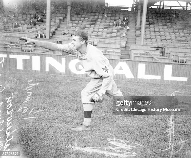 Informal full-length portrait of baseball player C. Mathewson of the National League's New York Giants, following through after throwing a baseball,...