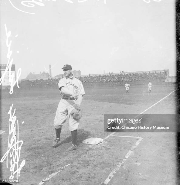 Informal full-length portrait of Hall of Fame second baseman Napoleon 'Nap' Lajoie of the American League's Cleveland Naps, following through after...