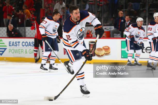 Eric Gryba of the Edmonton Oilers warms up on the ice prior to the game against the New Jersey Devils at Prudential Center on November 9, 2017 in...