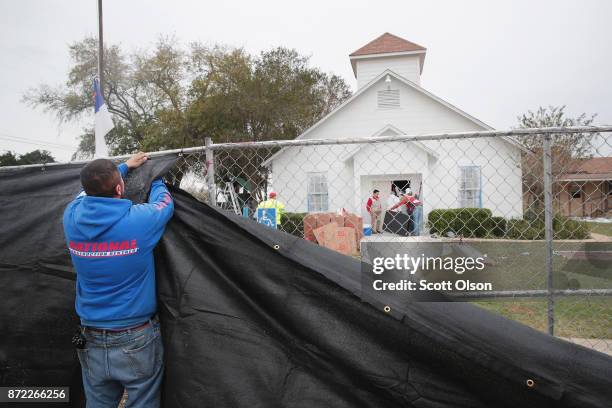 Tarp is wrapped around the First Baptist Church of Sutherland Springs as law enforcement officials wrap up their investigation into the shooting on...