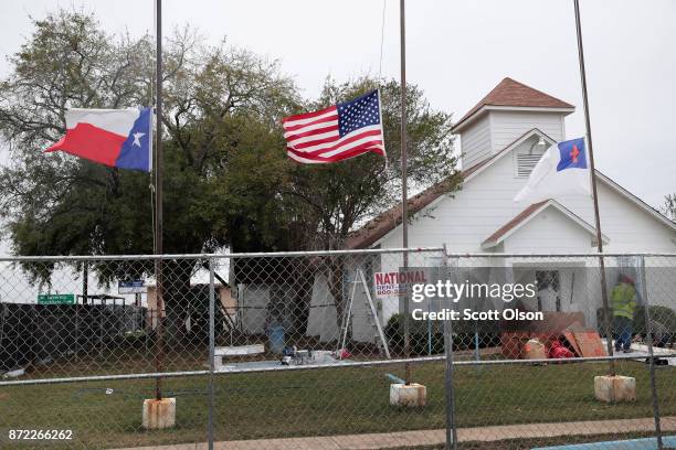 Workers patch bullet holes and paint the exterior of the First Baptist Church of Sutherland Springs on November 9, 2017 in Sutherland Springs, Texas....