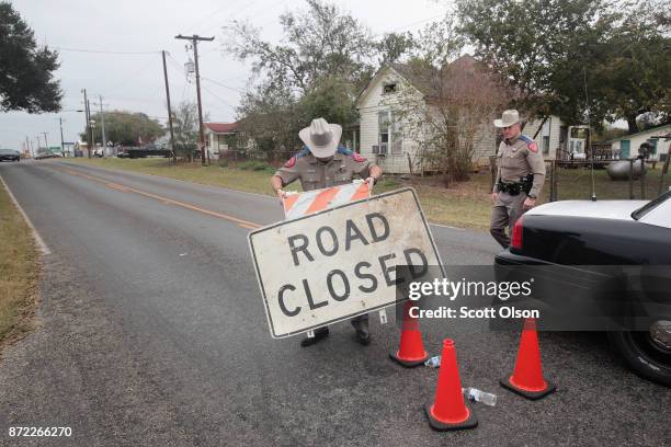 Police remove a road block as they begin to wrap up their investigation of the shooting at the First Baptist Church of Sutherland Springs on November...